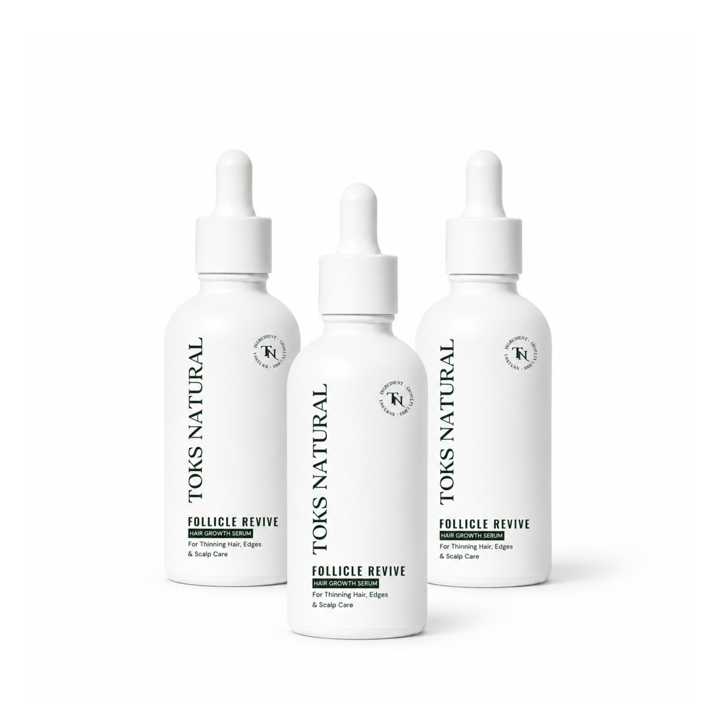 Three bottles of Toks Natural Follicle Revive on a white background