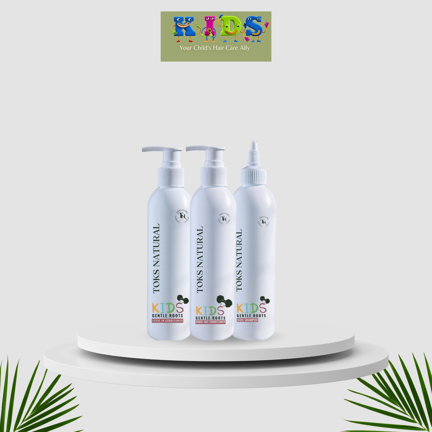 Three bottles of 'KIDS NATURAL' hair care products on a white platform with a brand logo above.
