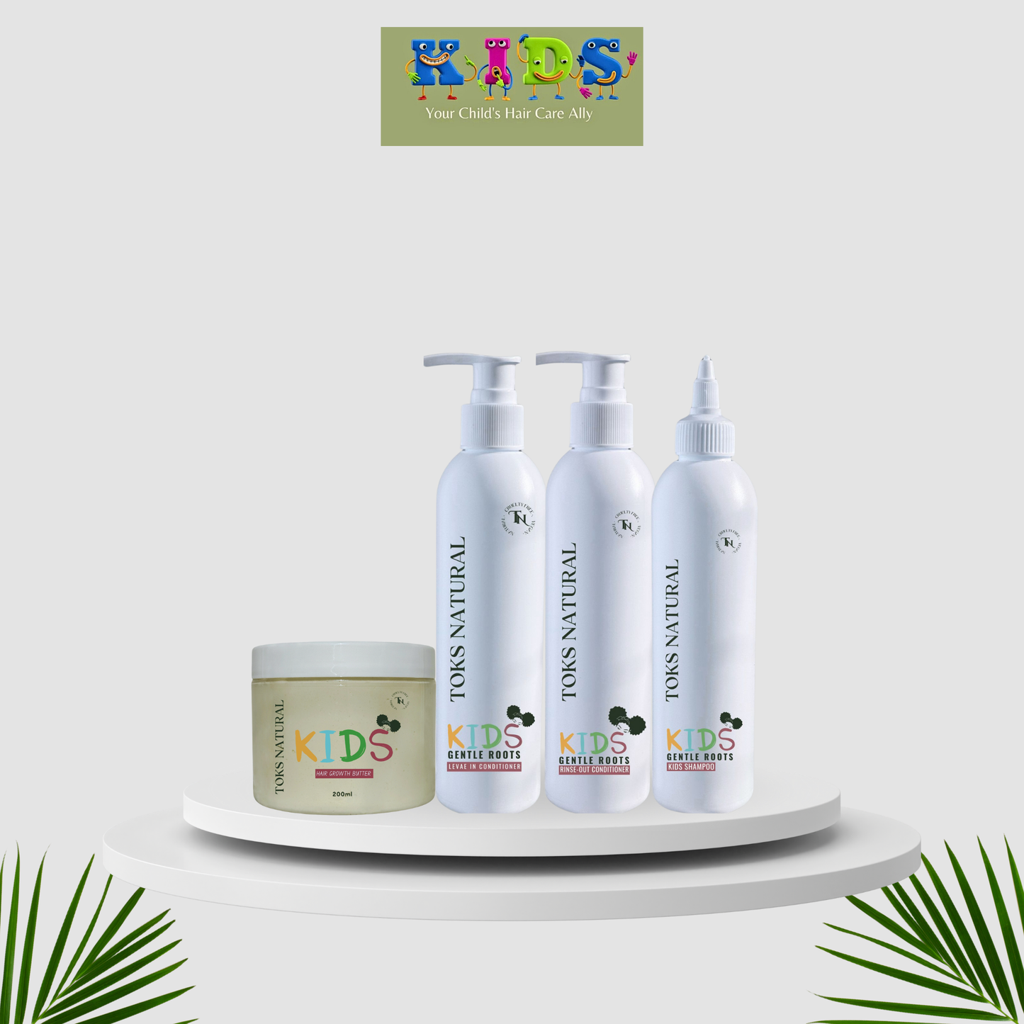 TOKS Natural Kids hair care products on a white platform with a branded logo in the corner.