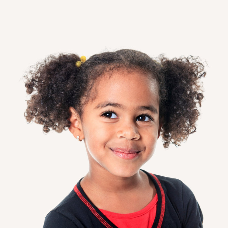 Toks Natural growth oil for kids, designed to support healthy curls and scalp