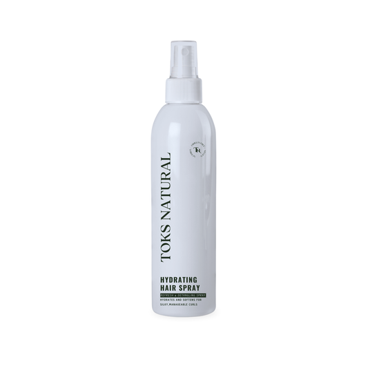 Tous Natural hydrating hair spray bottle on a white background