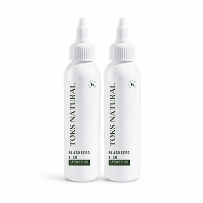 Two bottles of Toks Natural Blackseed & Co Growth Oil on a white background