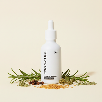 TOKS Natural Growth Revive herbal hair oil bottle with herbs on a beige background