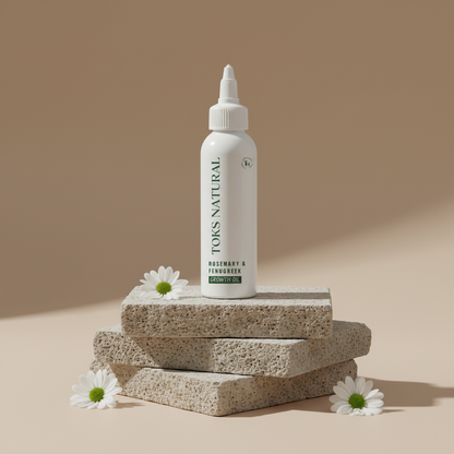 TOKS Natural growit oil bottle on stone blocks with flowers on a beige background
