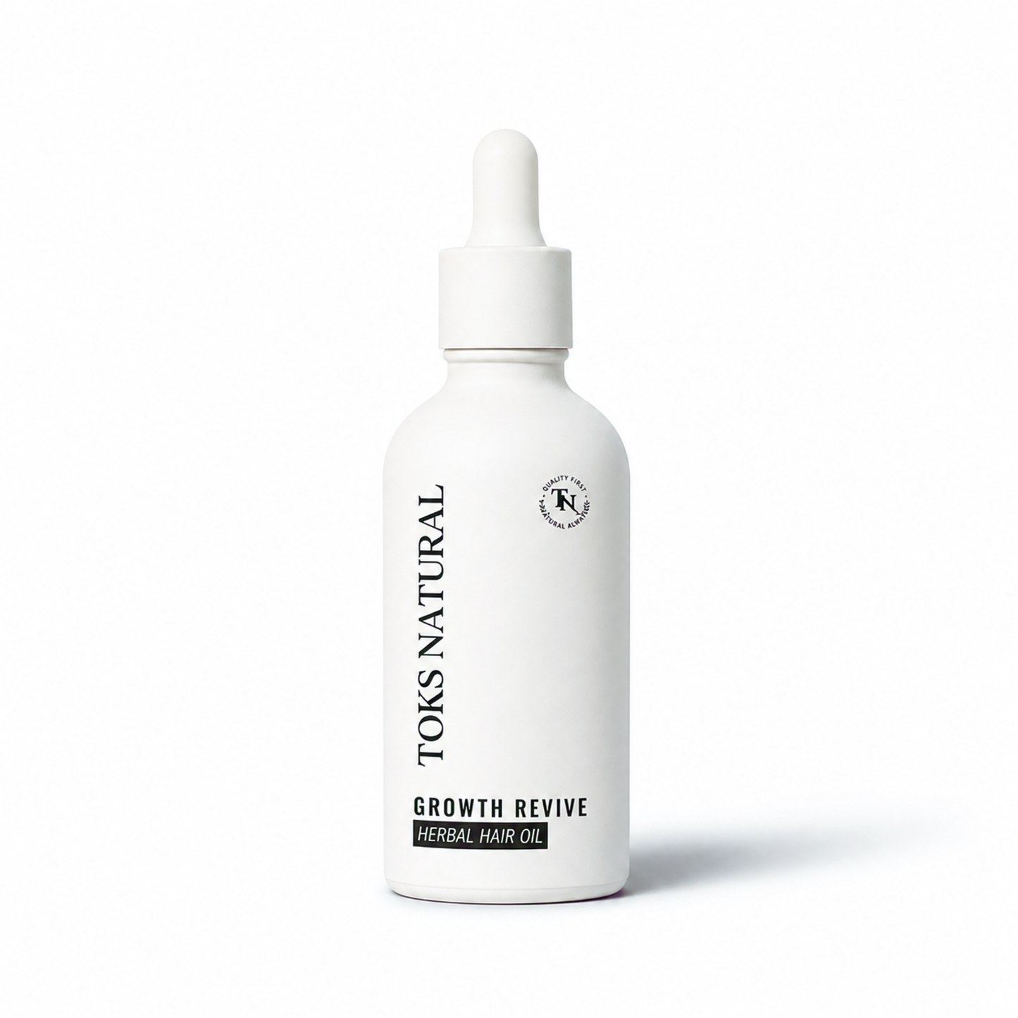 Toks Natural Growth Revive herbal hair oil bottle on a white background