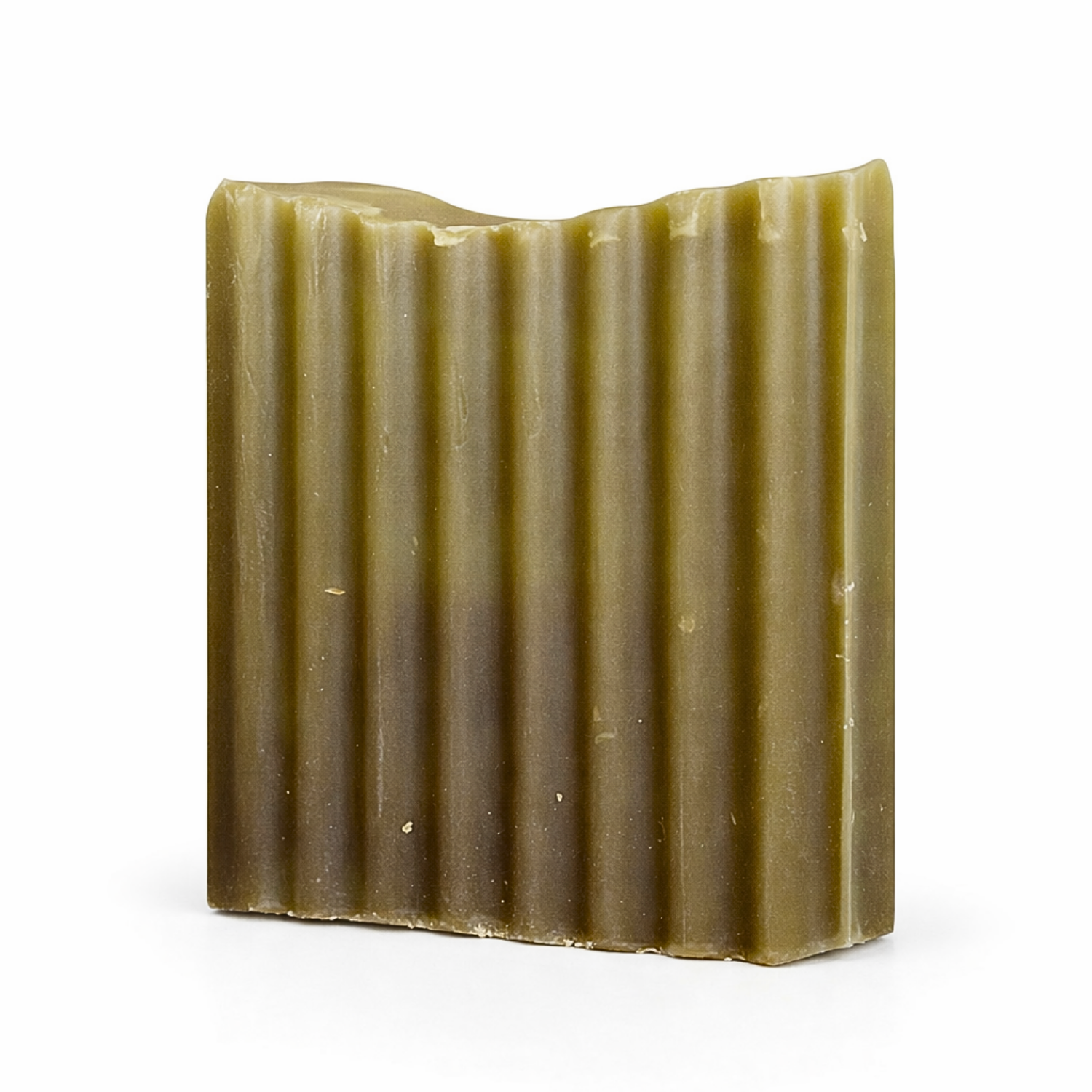 Bar of soap with a ribbed texture on a white background