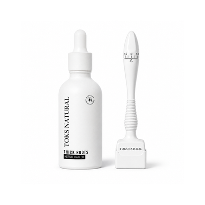 A white bottle of Toks Natural Thick Roots Hair Enhancer alongside a white application tool with a measuring scale, set against a plain white background.