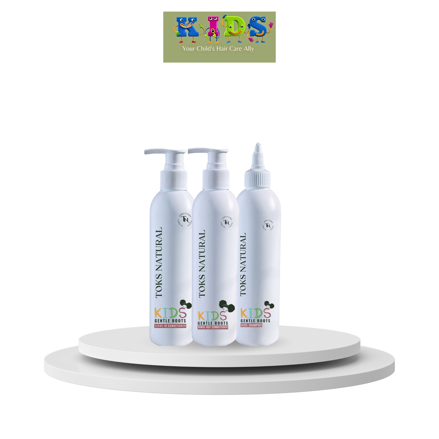 Three bottles of Kids Natural hair care products on a white platform with a colorful logo in the corner.