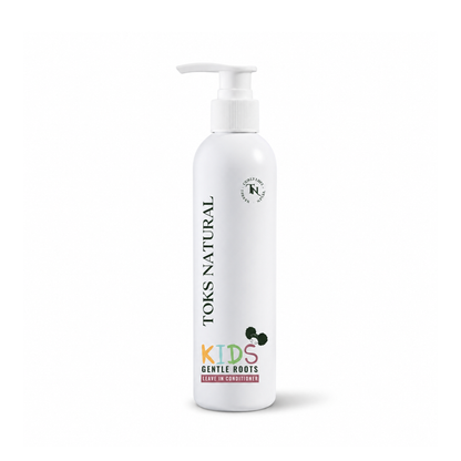 White bottle of Toms Natural Kids Gentle Roots hair care product on a white background