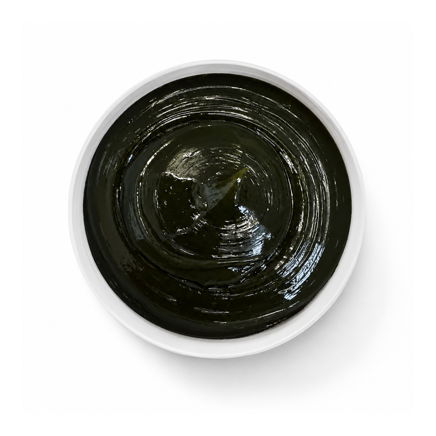 green grease in a white container on a white background