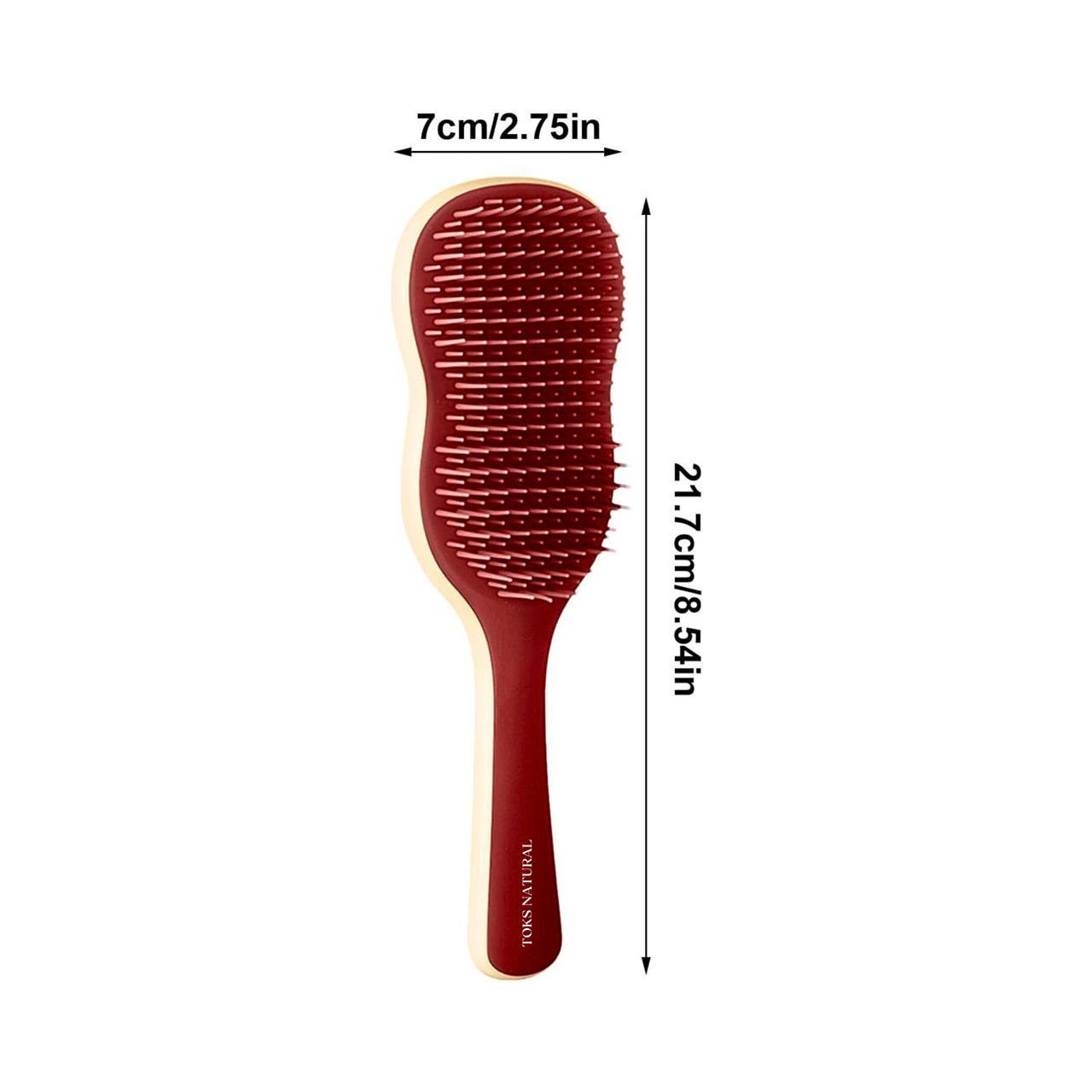 Red paddle hair brush with measurements on a white background