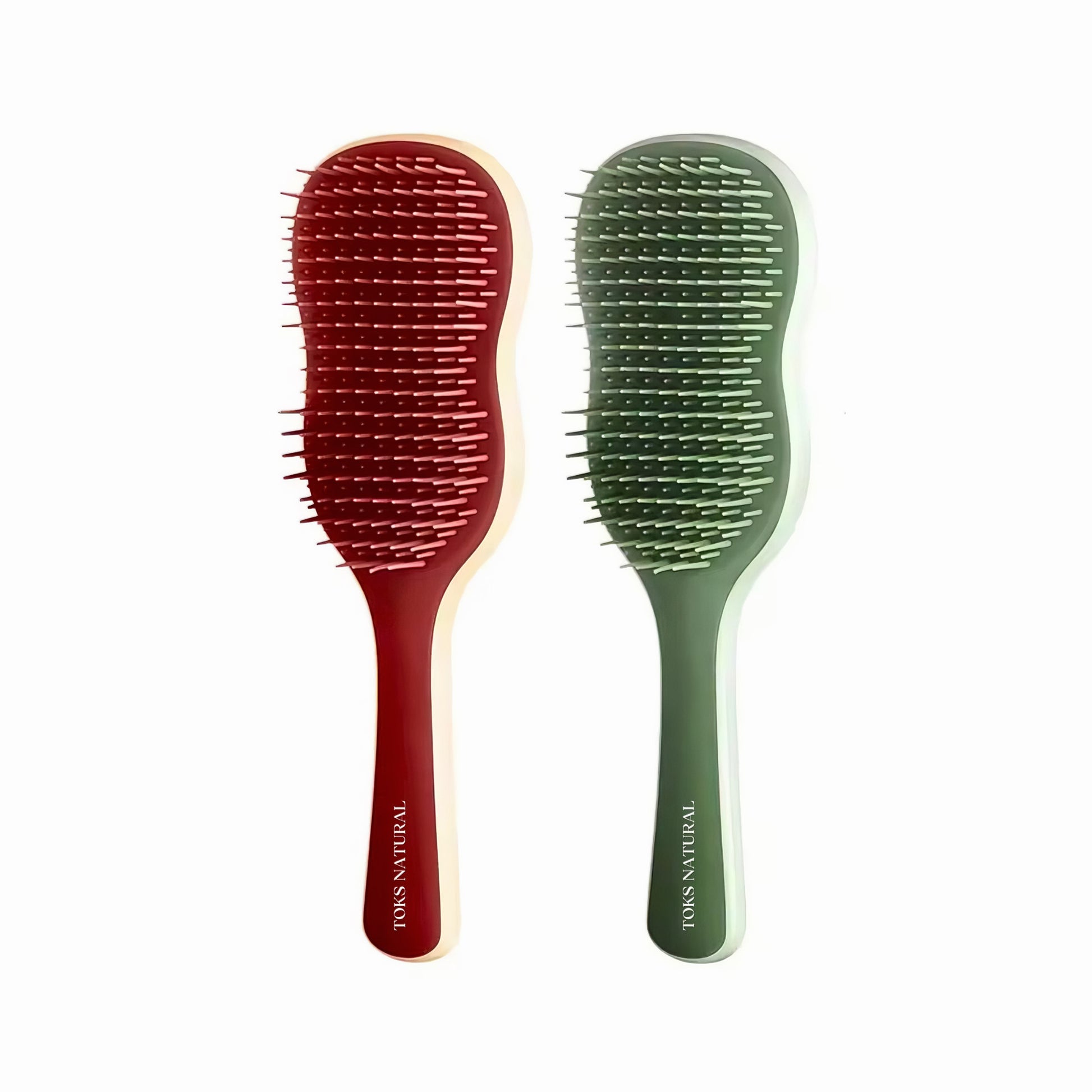 Two hairbrushes, one red and one green, on a white background with 'Tous Natural' branding.
