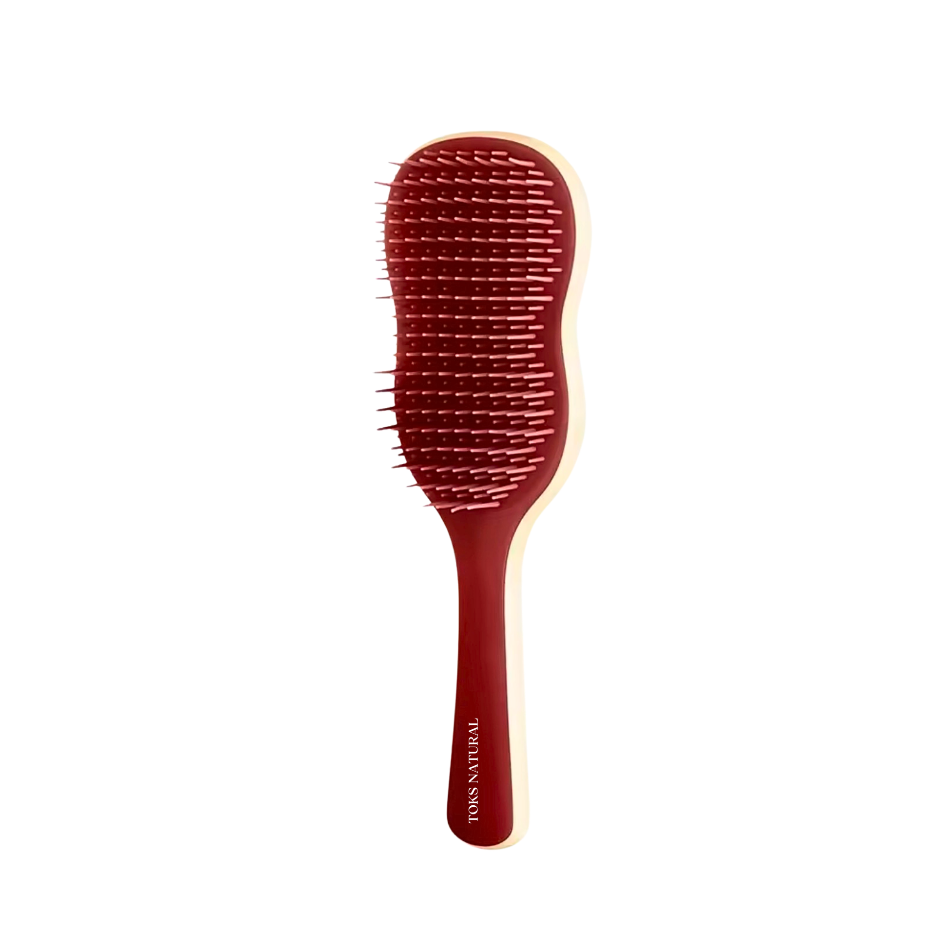 Red hairbrush with a white handle on a white background