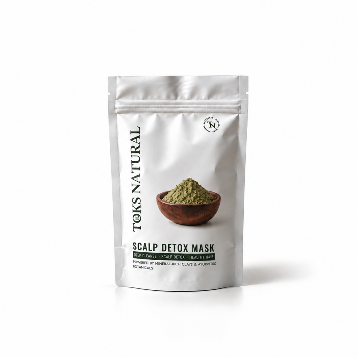 A silver stand-up pouch of Toks Natural Scalp Detox Mask, featuring a photo of green powder in a wooden bowl on the front, set against a plain white background.