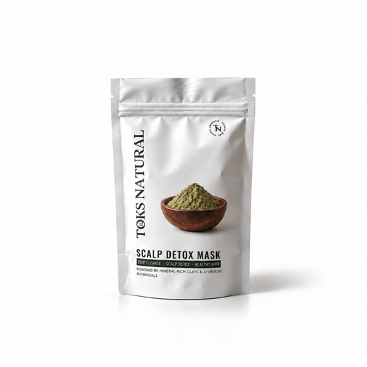 A silver stand-up pouch of Toks Natural Scalp Detox Mask, featuring a photo of green powder in a wooden bowl on the front, set against a plain white background.
