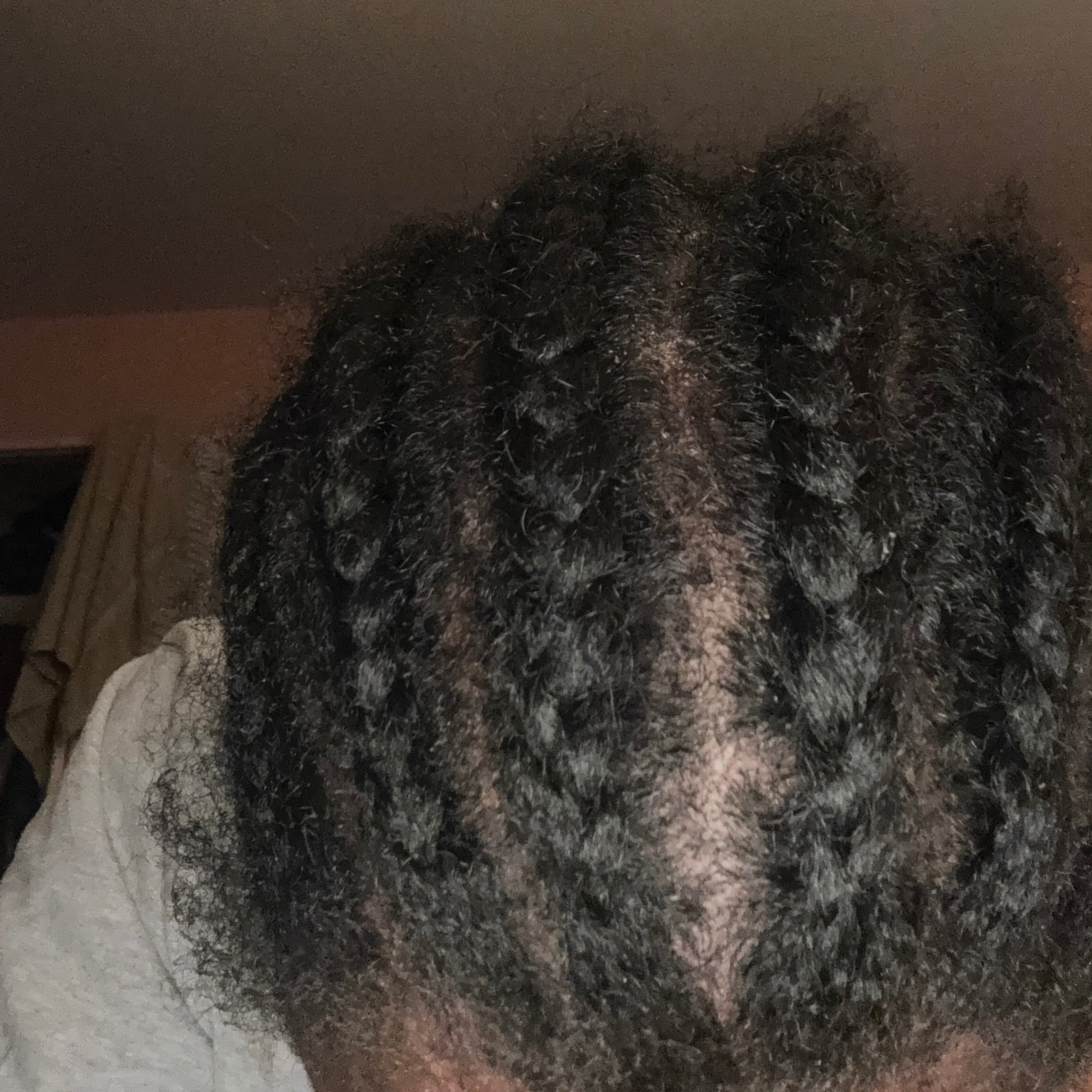Close-up of braided hair with a neutral background