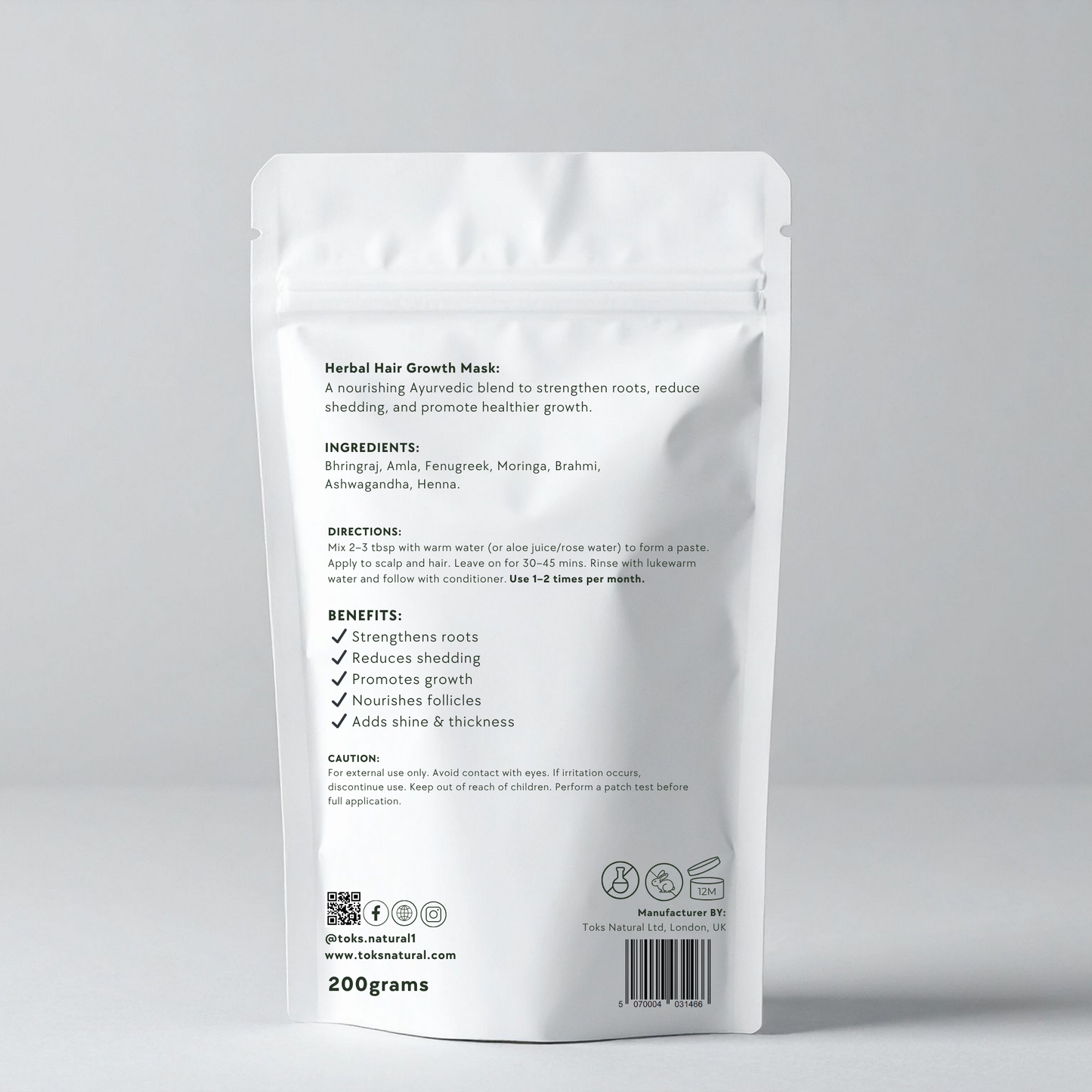 Herbal hair growth mask packaging with text on a gray background