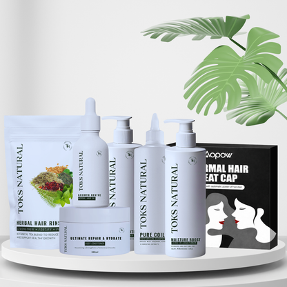 Set of TOKS NATURAL hair care products on a white surface with green leaves in the background.