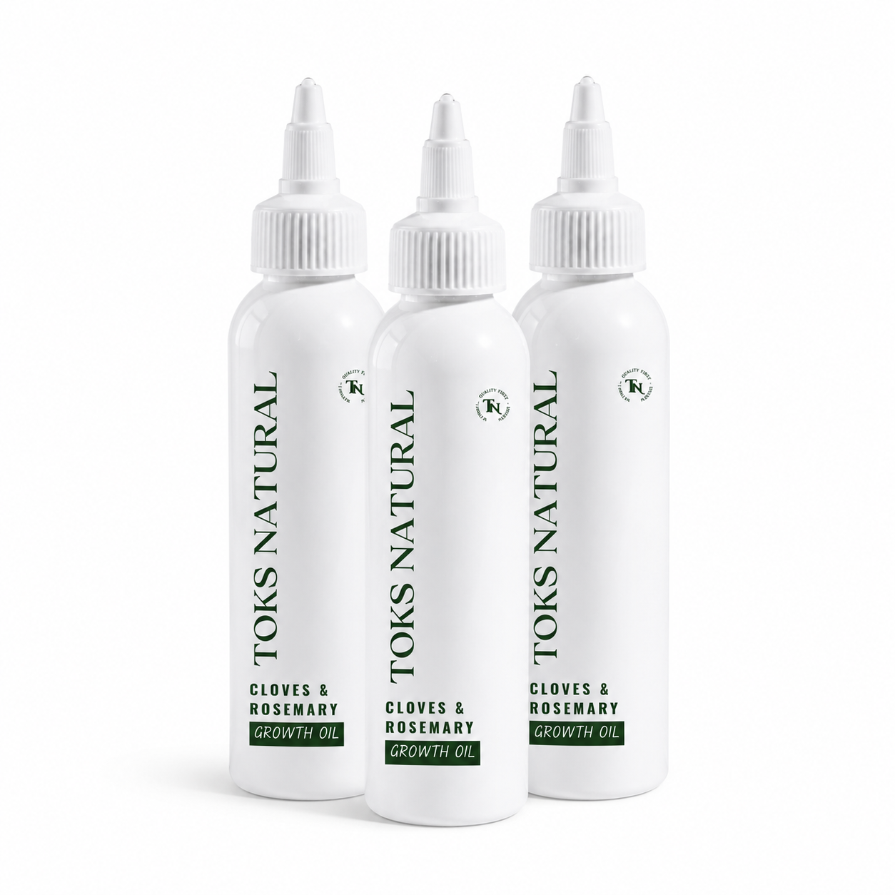 Three bottles of Toks Natural Cloves & Rosemary Growth Oil on a white background
