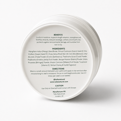 Back of a white hair product container with text on a white background