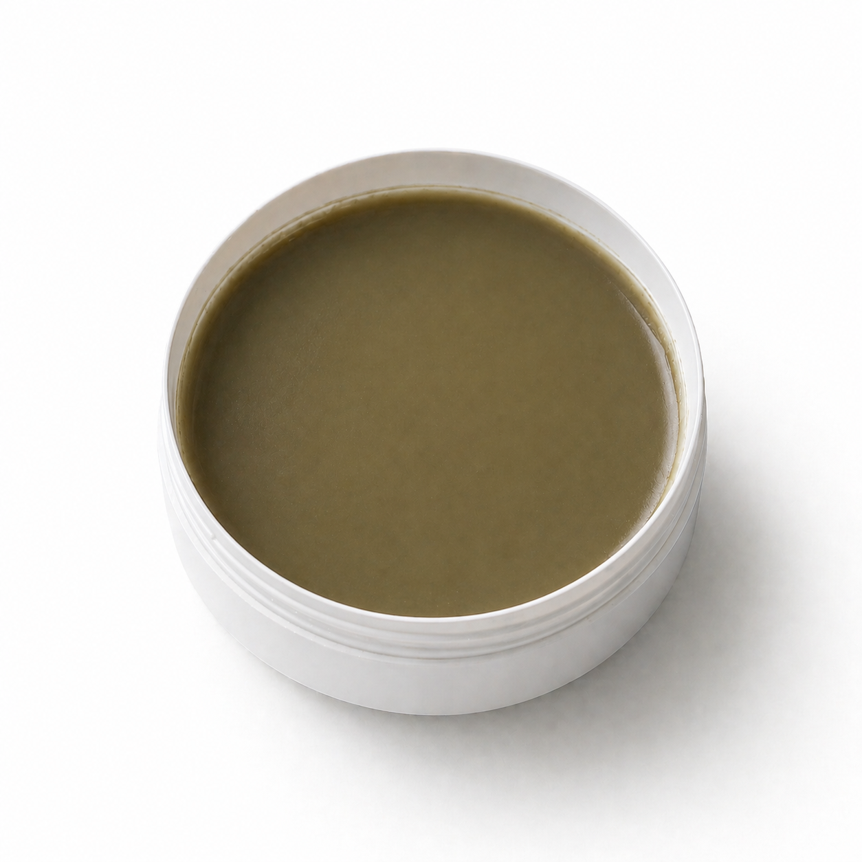 White container with brownish-green substance on a white background