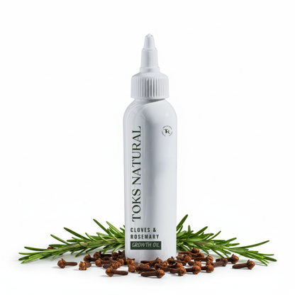 Toks Natural Cloves & Rosemary Growth Oil bottle with clove buds and rosemary sprigs on a white background