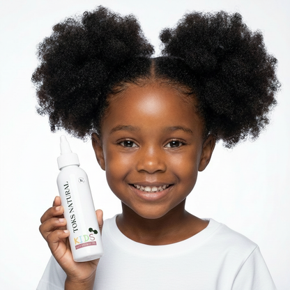 Child holding a bottle of TONS NATURAL hair product against a white background