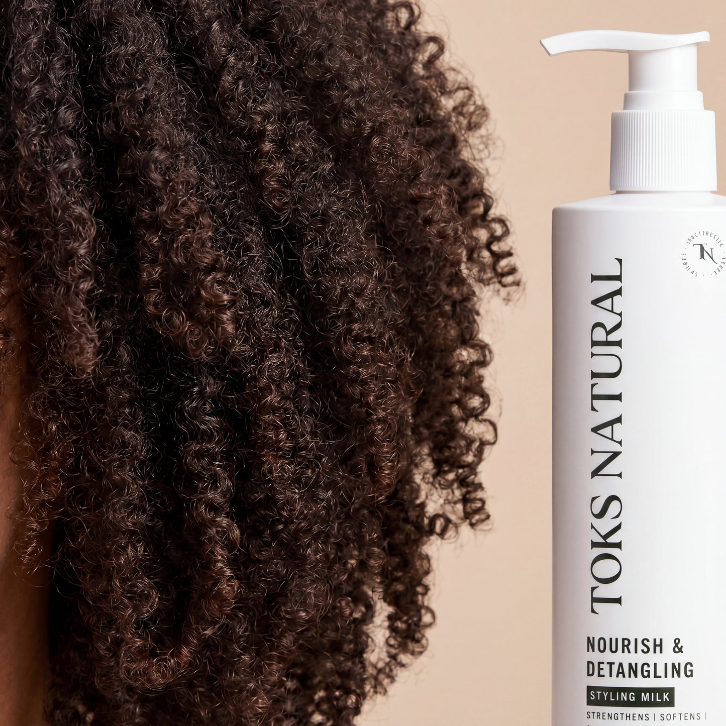 Toks Natural Nourish & Detangling Styling Milk bottle next to curly hair on a beige background