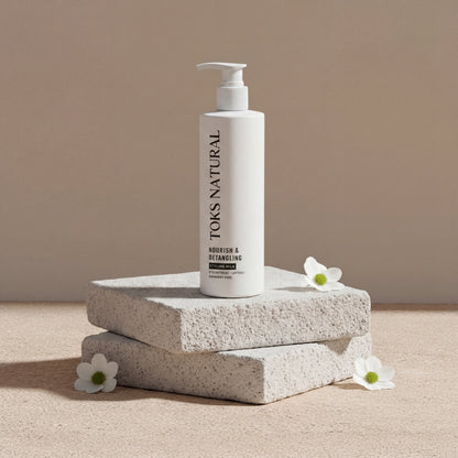 TOKS NATURAL shampoo bottle on a beige background with flowers