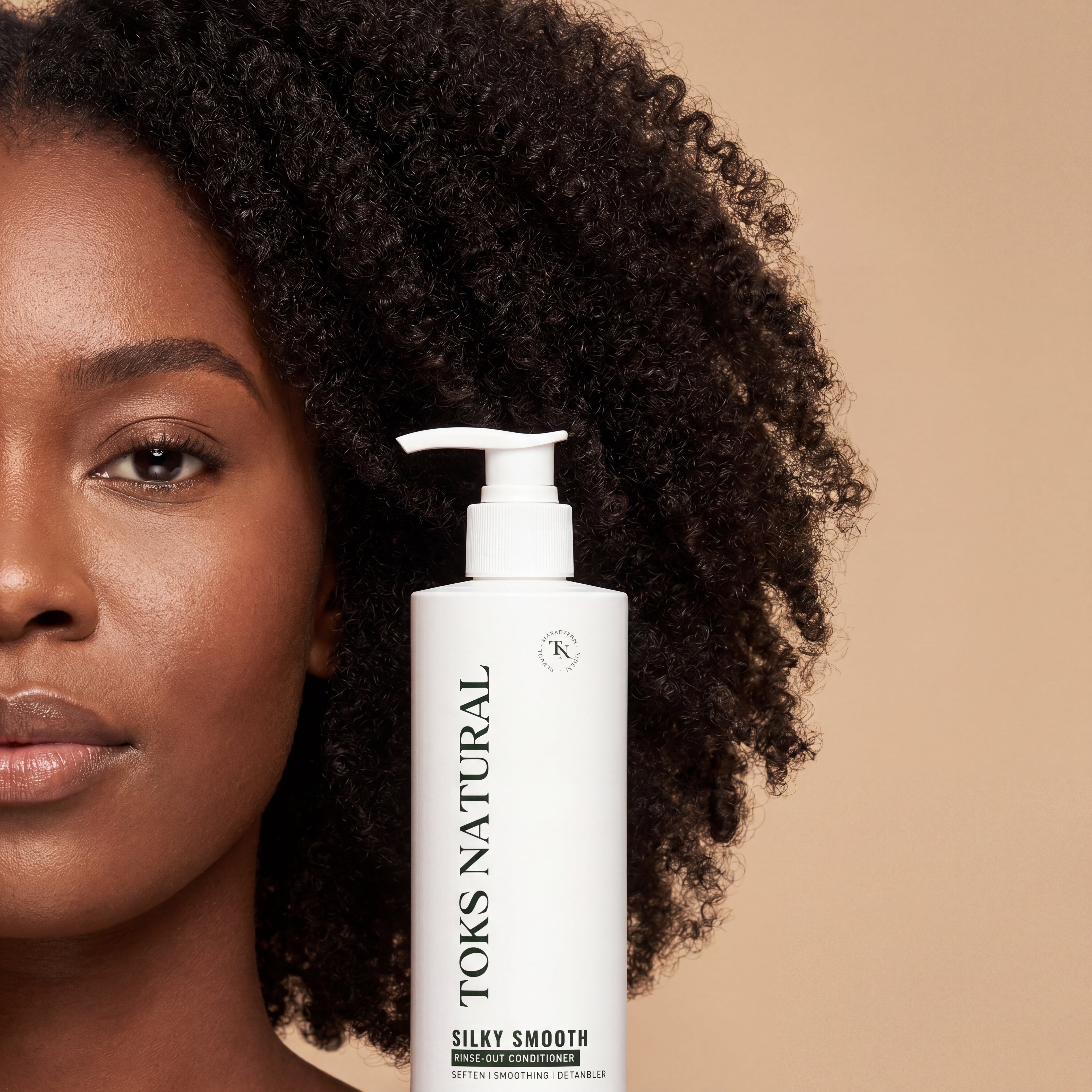 Woman with curly hair next to a bottle of TOKS Natural hair product on a beige background
