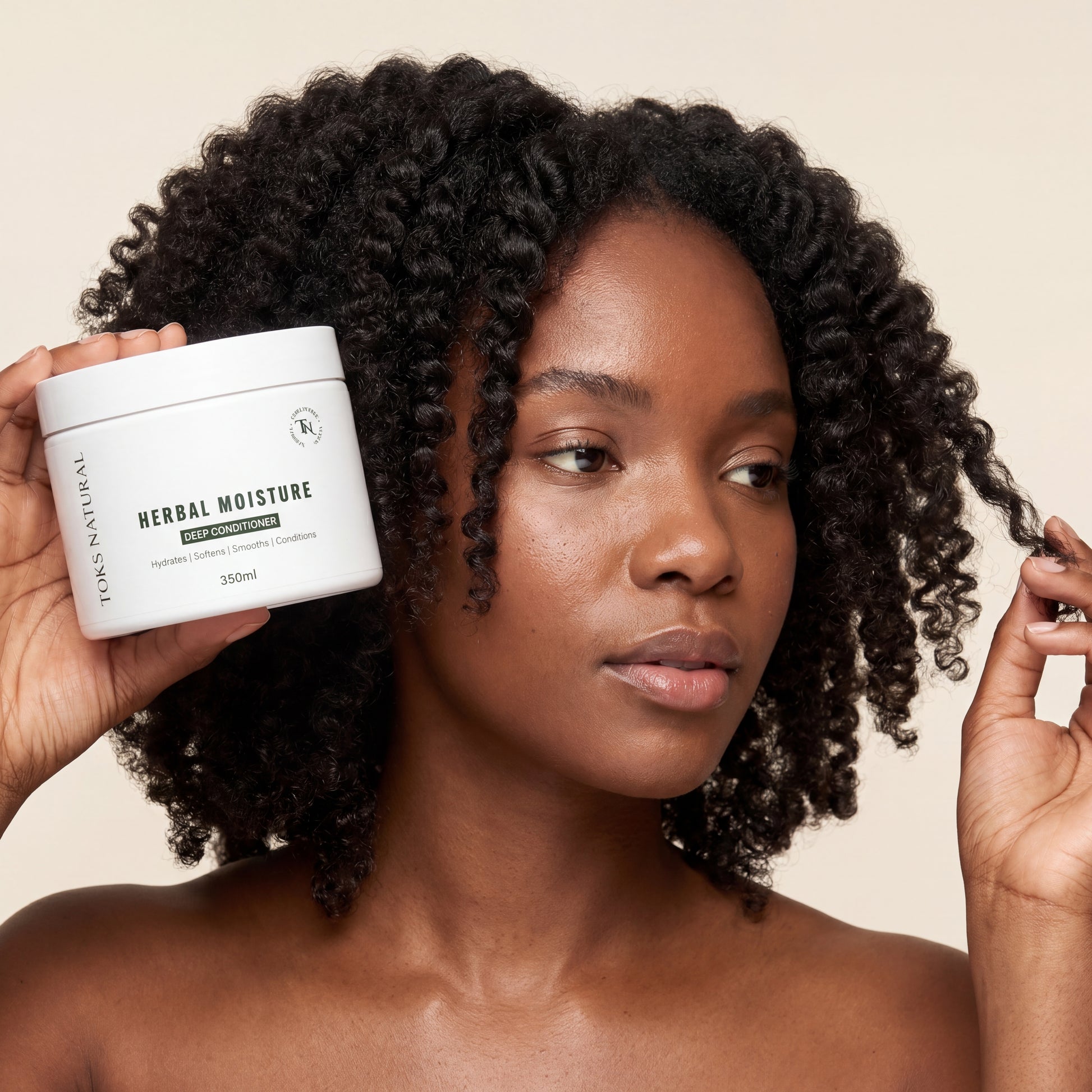 Woman holding a jar of 'Herbal Moisture' product with a neutral background