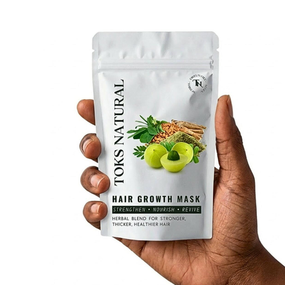 a dark skin hand holding our supper hair mask
