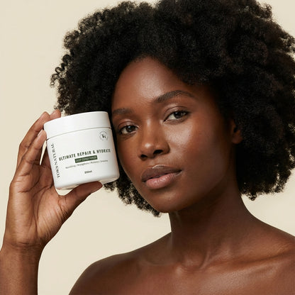 White container of TOKS NATURAL Ultimate Repair & Hydrate Deep Conditioner with green leaves in the background